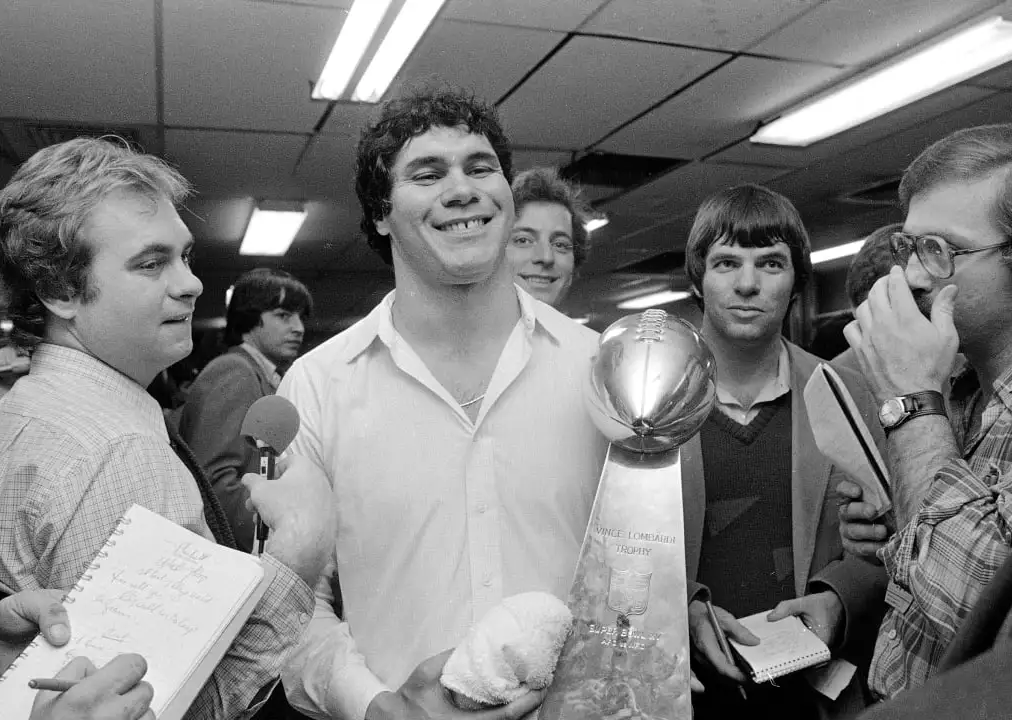 Super Bowl XV Champion QB Jim Plunkett with Vince Lombardi Trophy